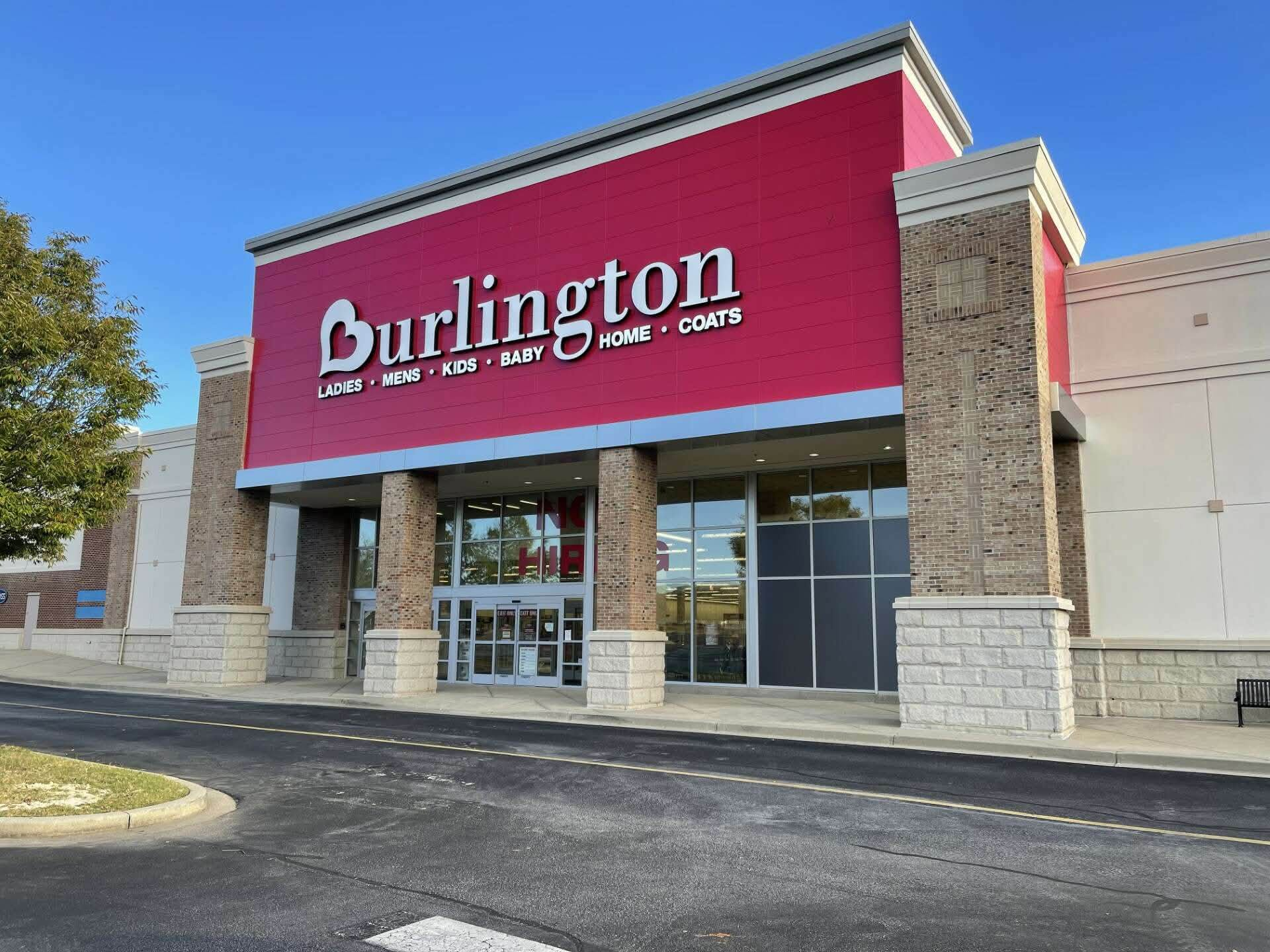 Retail store exterior with new brick columns and entry redesign