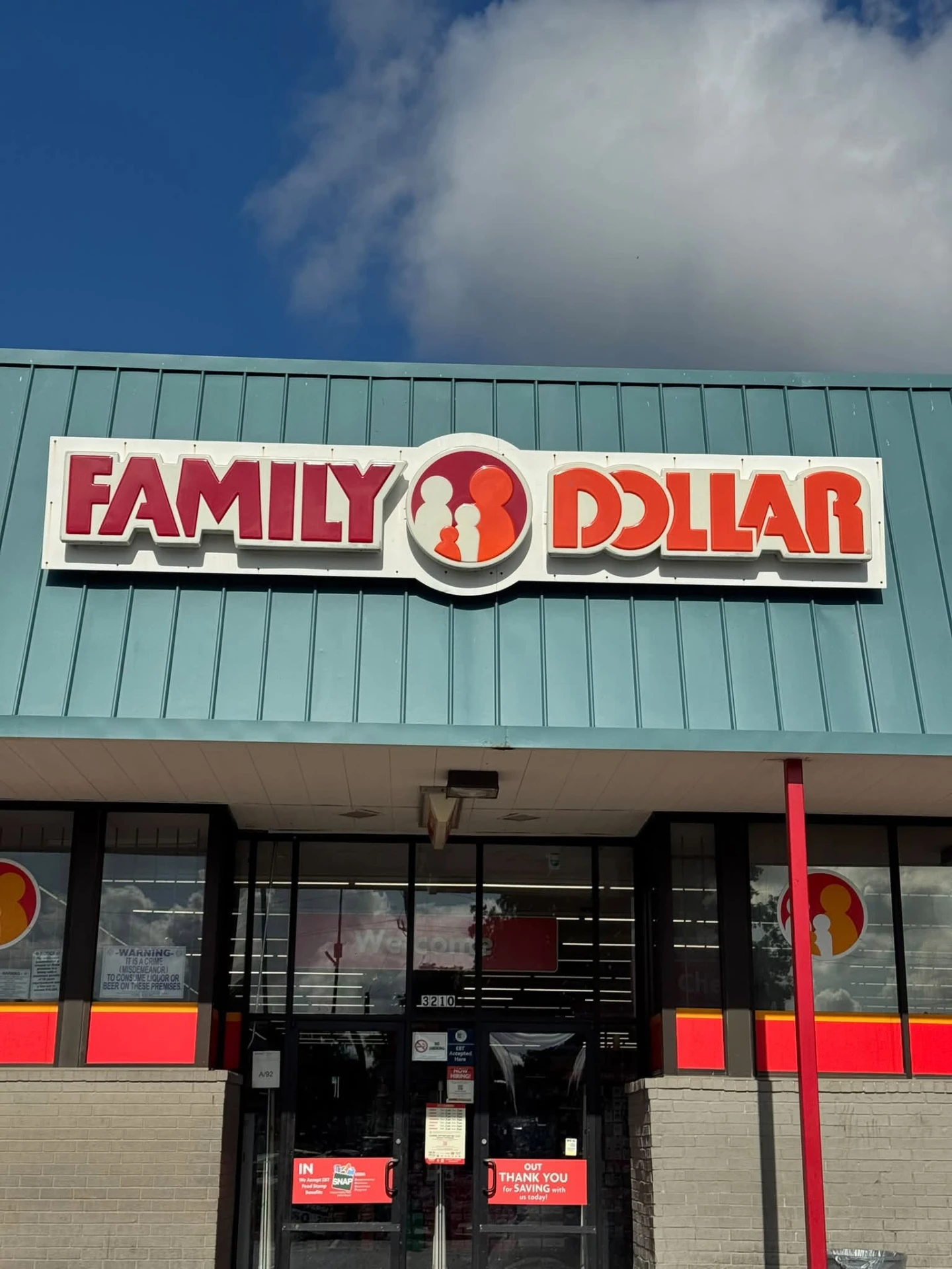 Neighborhood retail facade with new metal roof and signage